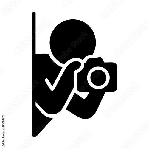 Spy photographer hiding behind wall with camera taking secret photo