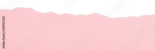 Edge of ripped smooth clean light pink paper isolated for scrapbooking