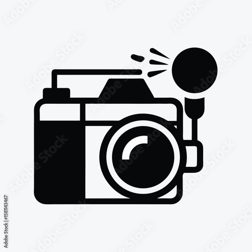 Black silhouette of a camera with a flash firing isolated on white background