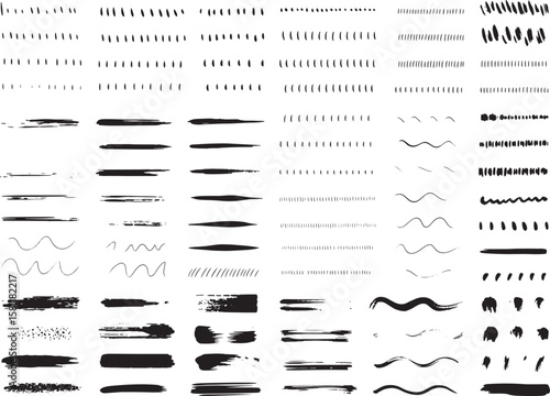 A variety of handdrawn brush strokes and lines in black and white isolated on transparent background