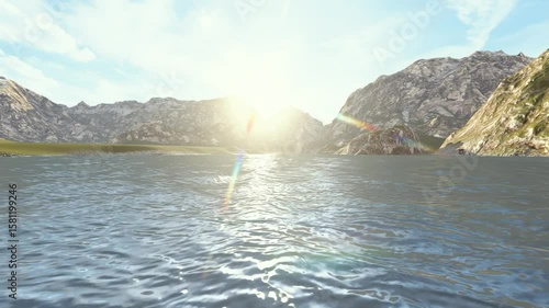 Clear lake with sun reflecting off the water, surrounded by scenic peaks