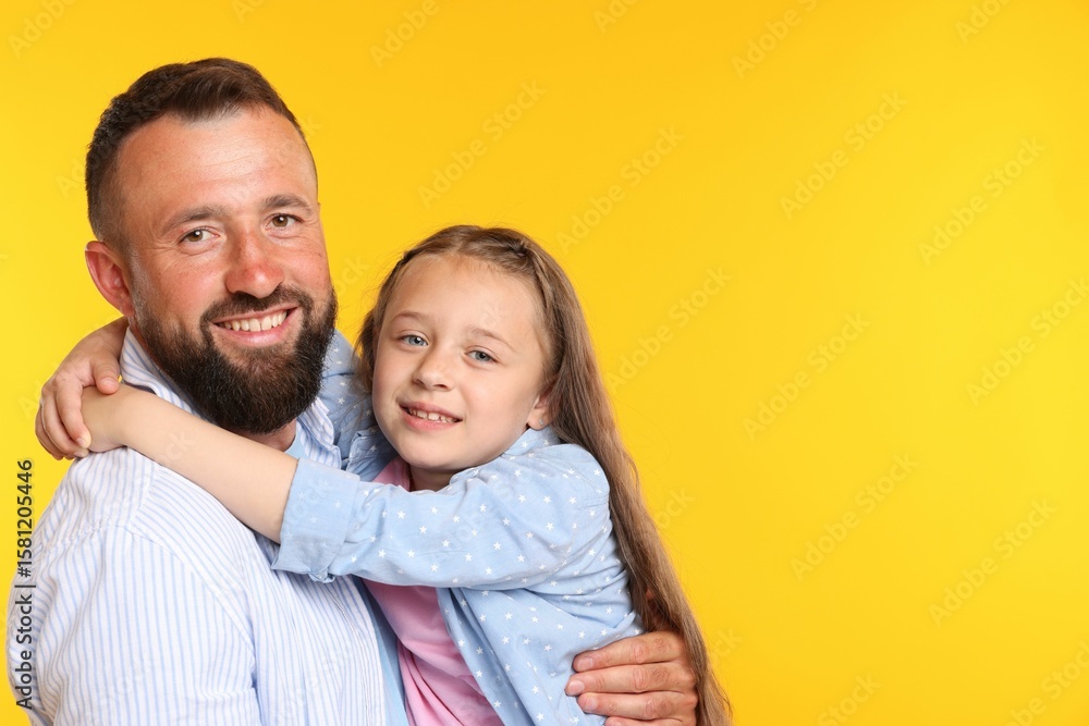 Family. Happy father and his daughter on yellow background. Space for text Family. Happy father and his daughter on yellow background. Space for text