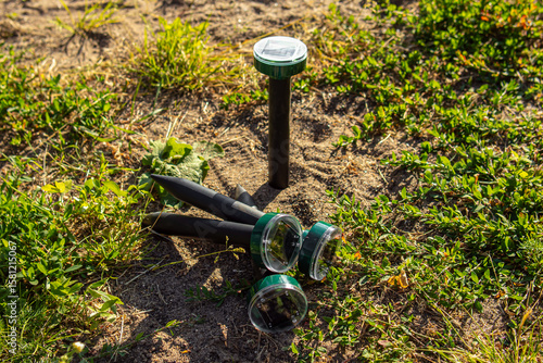 Solar-powered ultrasonic mole, mouse and snake repellents. Protection of the garden and garden beds from pests. Soft focus