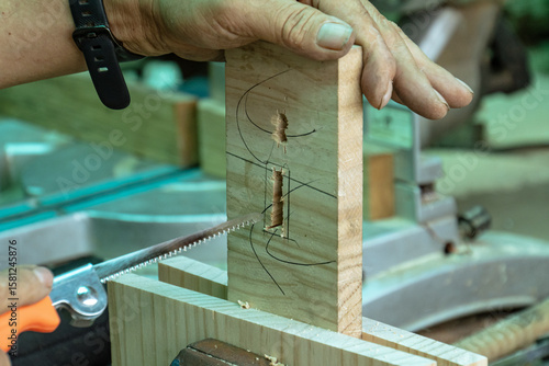 Woodworking Hand Detail with Precision Sawing