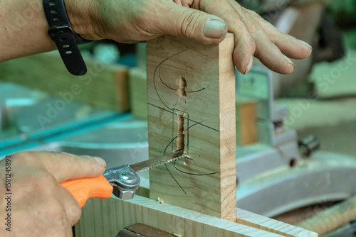 Woodworking Hand Detail with Precision Sawing