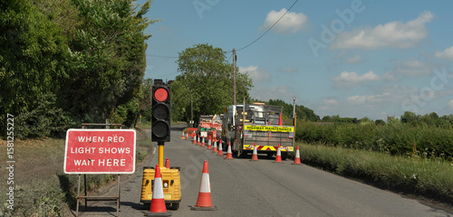 England United Kingdom. 30.06.2025. Road works and a stop light in the English countryside with a highway maintencance