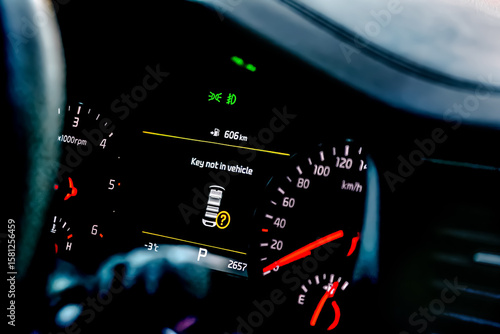 Car color screen dashboard with warning message.Key not in vehicle indicator.Intelligent driver digital information panel system in modern luxury automobile