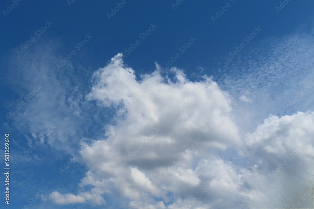 Fototapeta premium Beautiful clouds on blue sky background, natural cloudscape