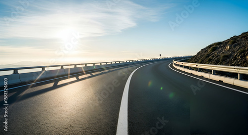 Scenic mountain road at sunrise offers a captivating journey through nature
