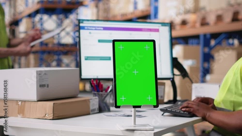 Wallpaper Mural Warehouse employee in hi vis vest uses copy space display with technology of shipping software, packaging systems and inventory management tools. E-commerce logistics. Camera B. Torontodigital.ca