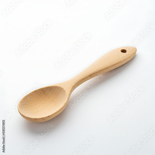 A simple, natural light-colored wooden spoon on a clean white background, representing kitchen utensils, cooking, and sustainable living.
