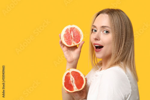 Young woman with grapefruit...