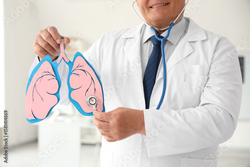 Mature doctor with stethosc...
