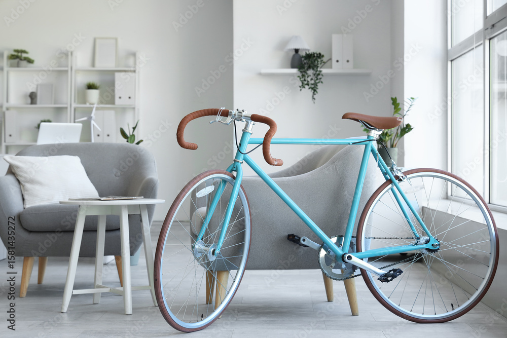 Interior of home office with bicycle and armchairs Interior of home office with bicycle and armchairs