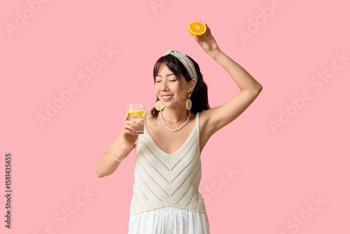 Young Asian woman with citr...