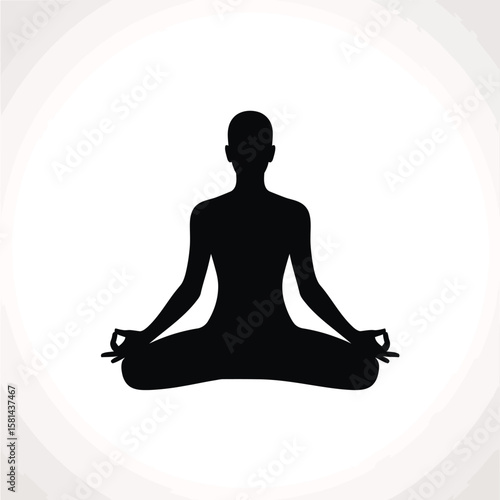 Silhouette of a person meditating in a lotus pose with hands in gyan mudra