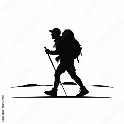 Silhouette of a hiker with a backpack and trekking poles walking on a path