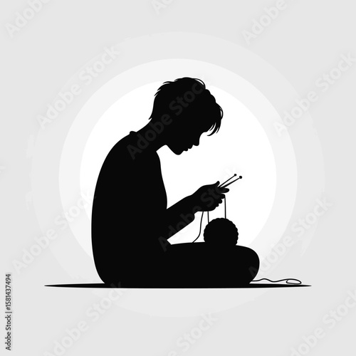 Silhouette of a person sitting and knitting with a ball of yarn and needles