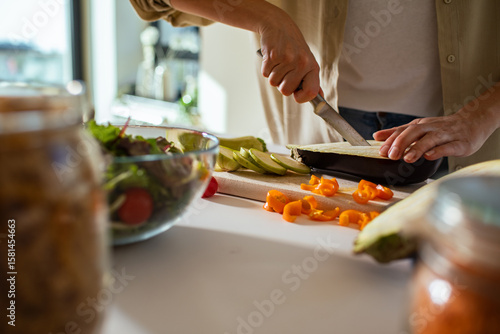 Close up of a woman preparing fresh vegetables for healthy home cooked meal