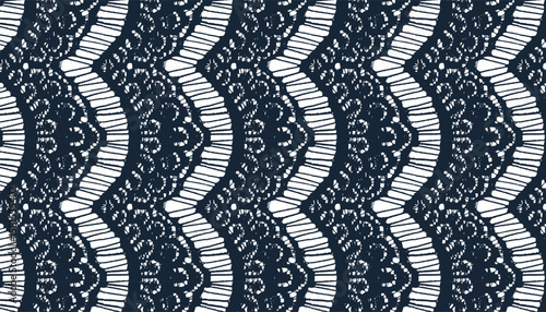 All-over seamless fabric adorned with fringed lace edging