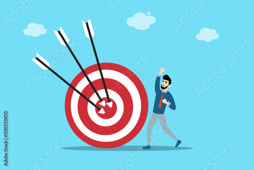 Cheerful businessman celebrating in front of a dartboard with arrows hitting the bullseye. Symbol of achieving business goals.