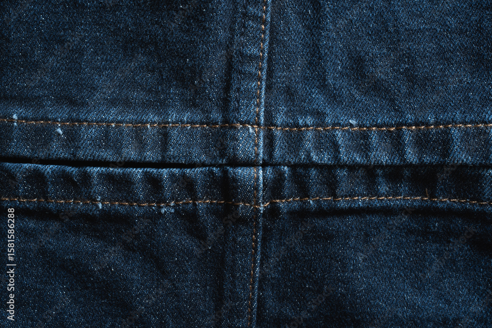 The leg opening of blue jeans, with stitching that divides the fabric equally into four sections The leg opening of blue jeans, with stitching that divides the fabric equally into four sections