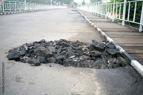 Pile of asphalt rubble on the side road
