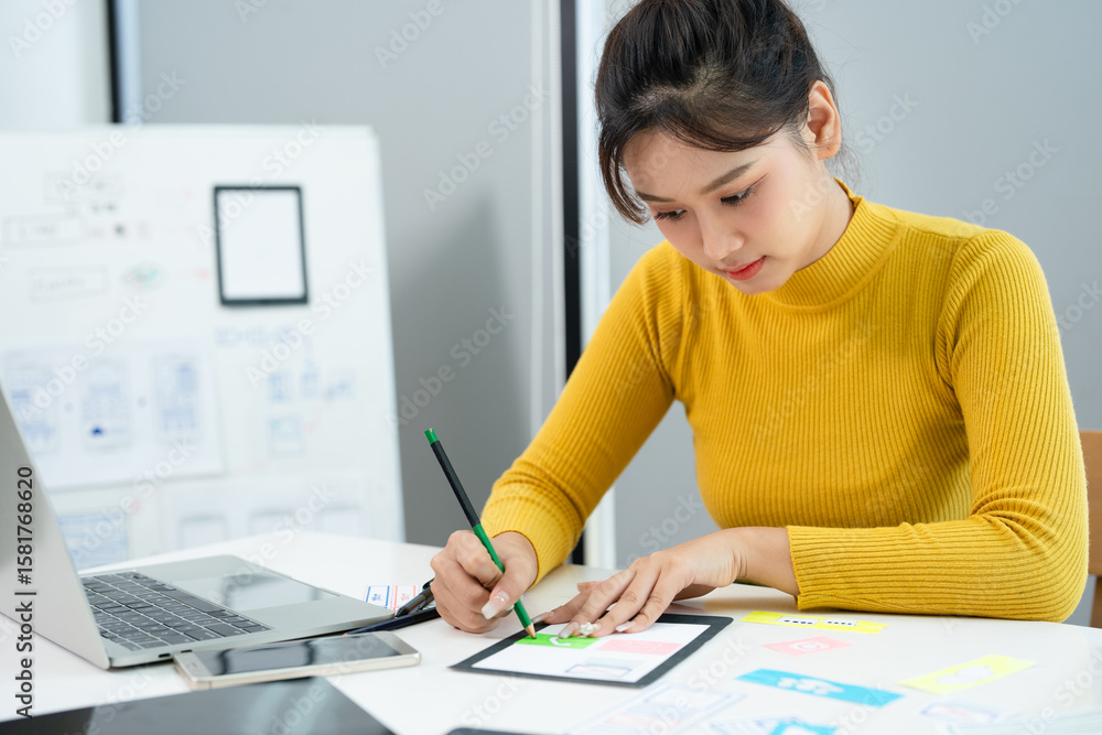 Mobile application design. Creation of sketch of application interface. web designer. UX Designer draws apps on paper. Web architect at desk. Mobile application design. Creation of sketch of application interface. web designer. UX Designer draws apps on paper. Web architect at desk.