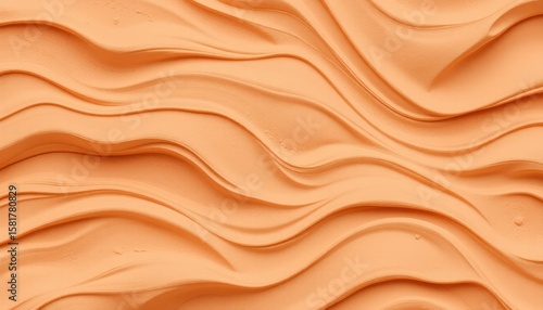 Abstract image of orange wavy texture, smooth flowing lines and shapes