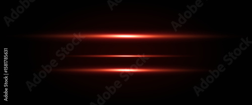 Red neon stripes or light flash. Laser beams, horizontal beams. Beautiful light reflections. Glowing stripes on a black background.