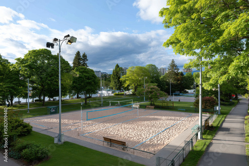 Wallpaper Mural Beautiful beach volleyball court surrounded by lush green trees and clear blue sky, inviting outdoor activity and relaxation Torontodigital.ca