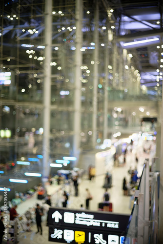 Bokeh of unfocused lights reflected in airport window