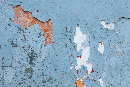 light blue concrete wall texture. Rough stone texture. Stone background. Cracked paint and plaster.