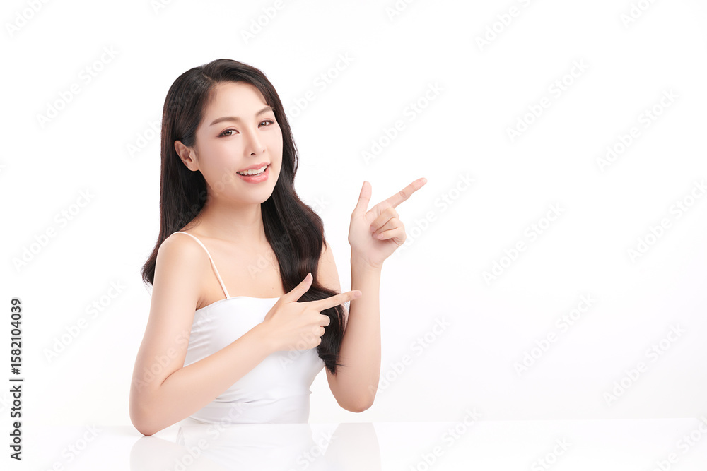 A beautiful young Asian woman with clean, fresh skin against a white background. Skincare, facial treatment, cosmetology, beauty, and spa. An elegant portrait of an Asian woman. A beautiful young Asian woman with clean, fresh skin against a white background. Skincare, facial treatment, cosmetology, beauty, and spa. An elegant portrait of an Asian woman.