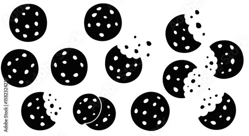 Silhouette pattern of polka dot cookies with bites missing on white background