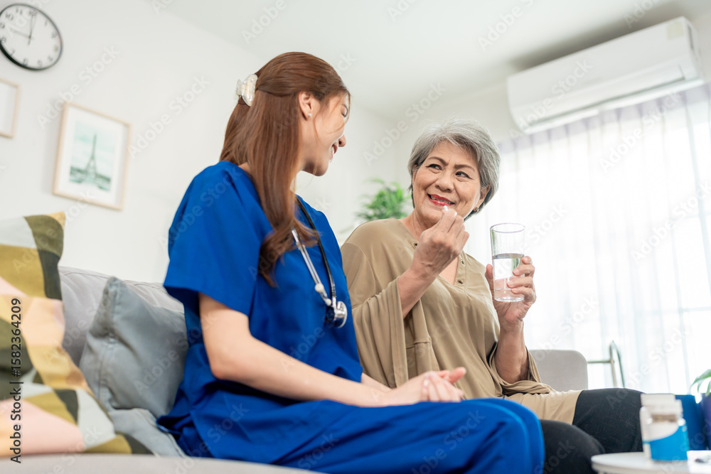 Obraz premium Asian caregiver give consultant to senior woman patient at nursing home. 