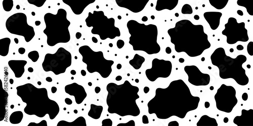 シームレスな白黒の牛柄背景イラスト