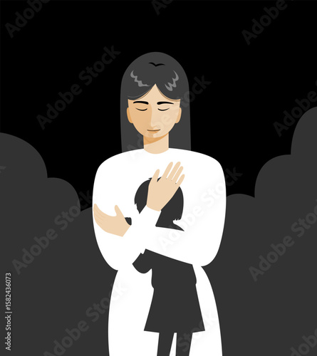 A woman standing and hugging herself while tapping, as if she talking to her inner child.