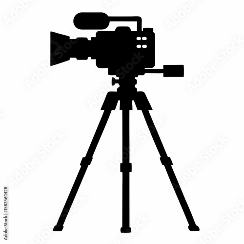 Black silhouette of a professional video camera on a tripod isolated on white background studio equipment