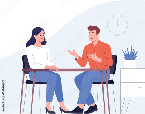 Two professionals having a discussion across a table in a modern office setting
