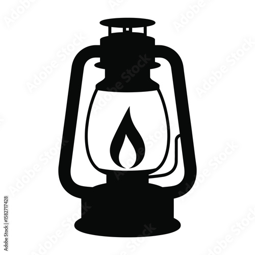 Classic kerosene lantern with a burning flame inside isolated on white