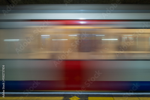 Canvas Print Train blurs past platform at Baker Street London Underground station
