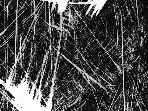 Intricate patterns of scratched surface reveal textured artistry in black and white