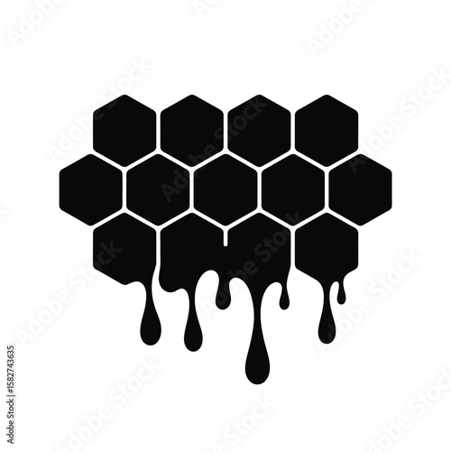 Black honeycomb dripping with honey on a white background