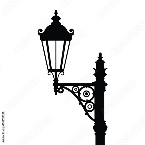 Elegant black silhouette of a vintage ornate street lamp on a white background