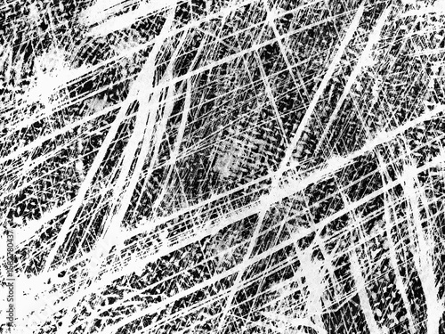 Intricate patterns created by tire tracks on a gravel surface revealing the passage of vehicles over time