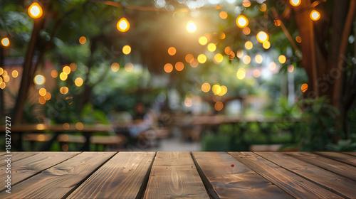 Backyard background party, empty wooden tabletop sale with blurred bokeh background. Bbq party, rustic wood background summer. Wooden table outside holiday product, night party table top
