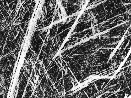 Abstract black and white texture with intricate patterns resembling scratch marks on a surface