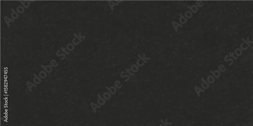 Textured black leather fabric with a dark, rough pattern and a gray chalk background