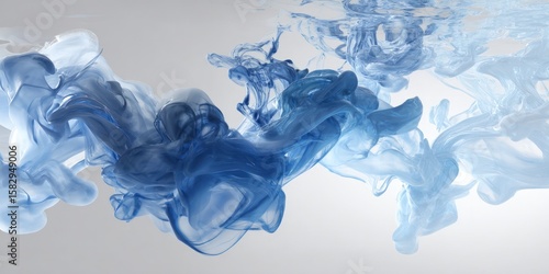 Photo of abstract swirls of blue ink gracefully mingle in water, creating a dynamic and artistic visual effect that evokes a sense of fluid motion